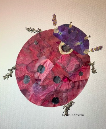lady bug made with pressed poppies and lavendel